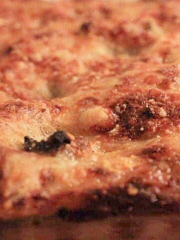 Top of a lasgane, baked and bubbling.