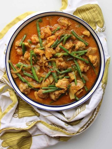 Malaysian chicken in a bowl on a green cloth