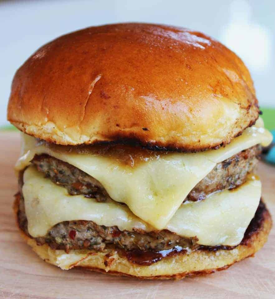 Pork burger with cheddar cheese and a rhubarb and apple chutney