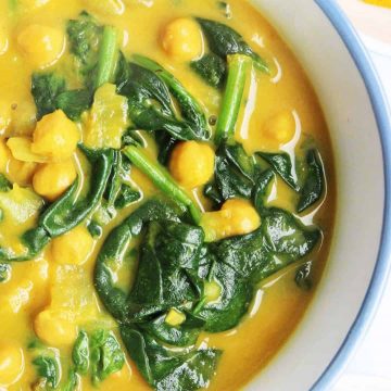 Close up of a bowl of chickpea & spinach curry