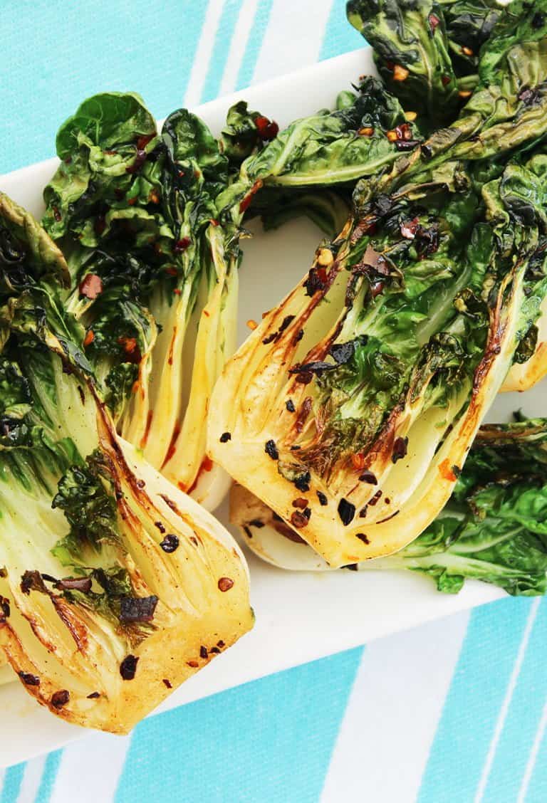 Cooked pak choi on a blue background