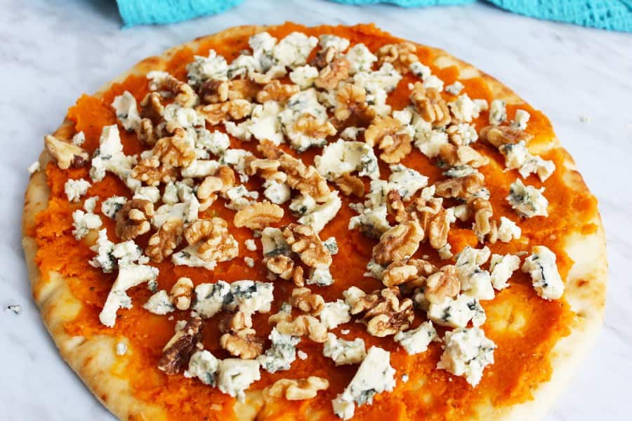Blue cheese pizza with pumpkin with blue cheese and walnut topping, un cooked