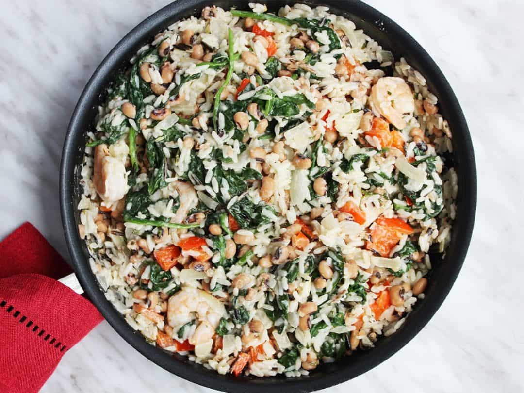 Shrimp, rice and vegetables in a frying pan before serving