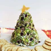 A Christmas tree cheese ball with crackers