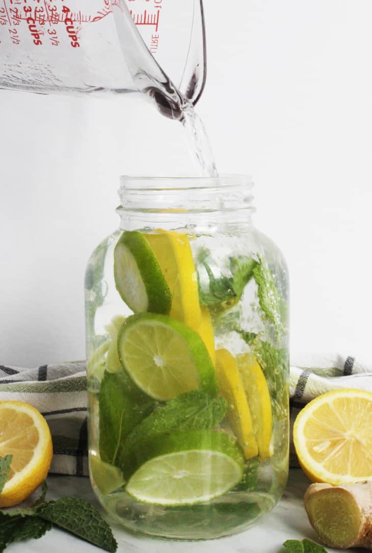 Water being poured to the top of the mason jar