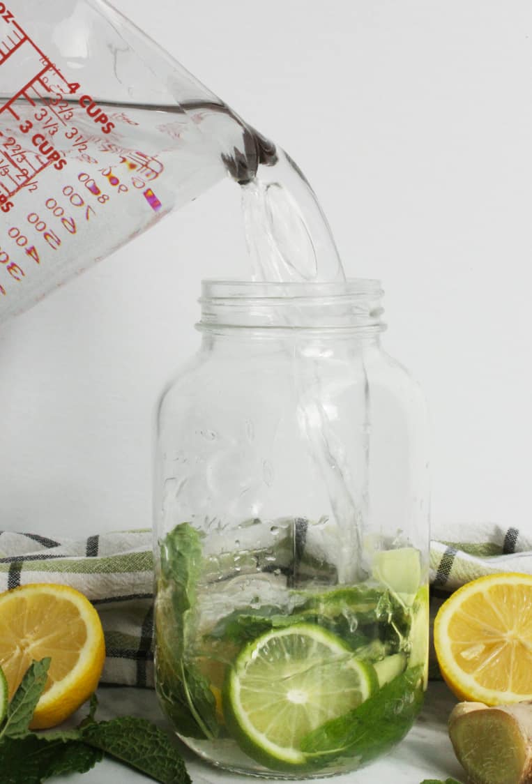 Water being poured into a mason jar