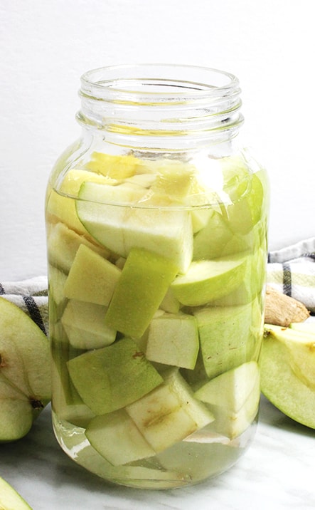Green apple vodka in a glass jar