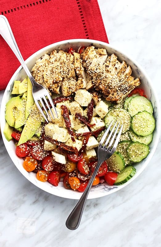 Top down shot of chicken salad in a white bowl