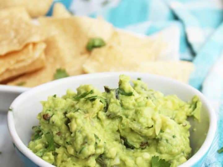 Close up of jalapeno guacamole in a blue bowl