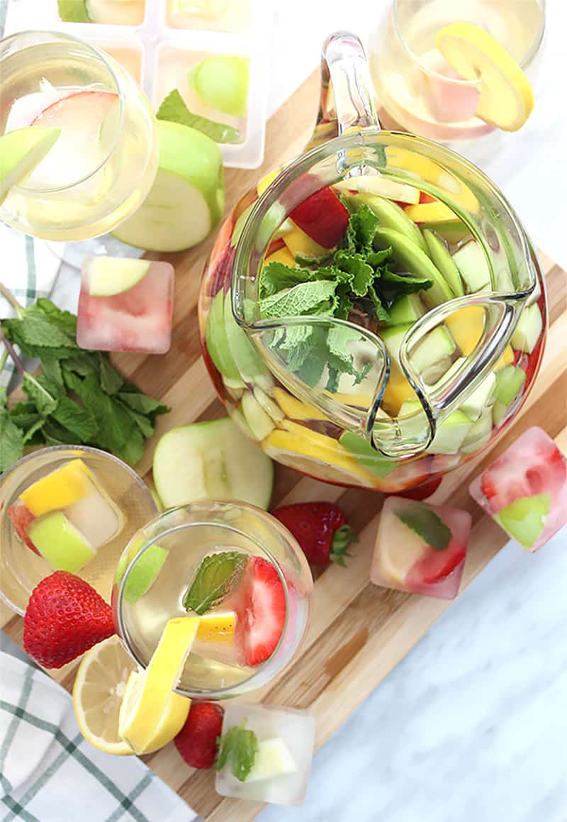 Top shot of a jug of sangria with filled wine glasses