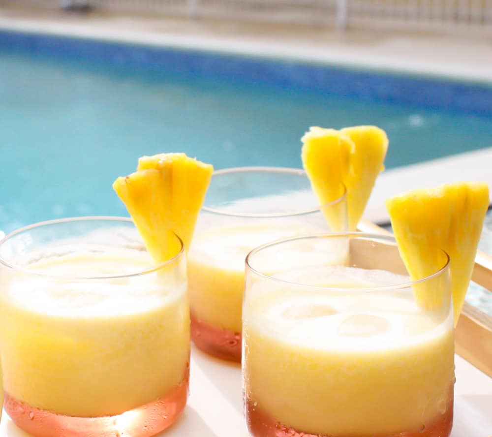 coconut pineapple cocktail in three glasses