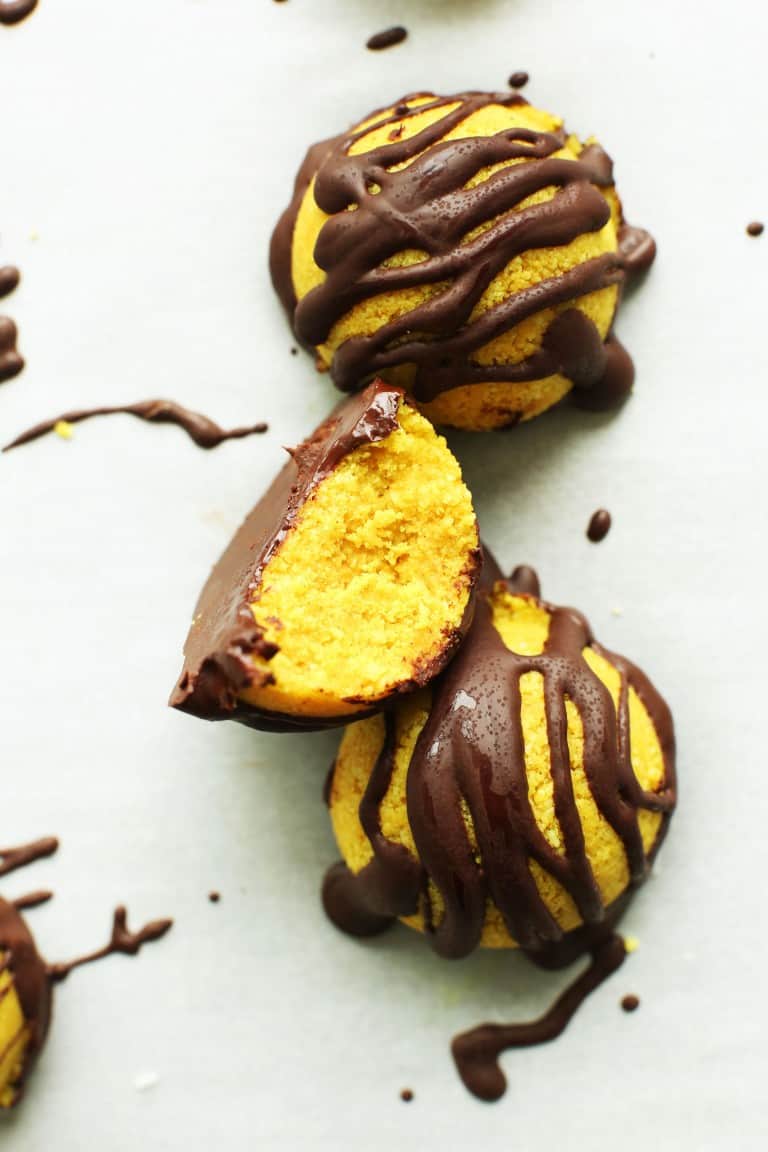 Golden milk macaroons on a white surface