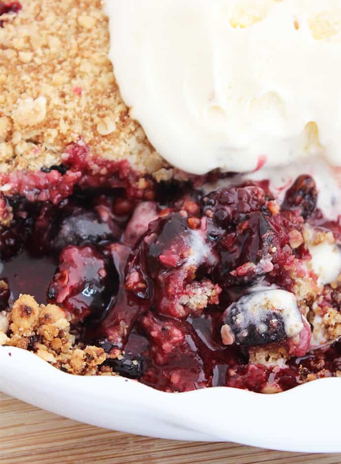 Close up of the blackberry and cherry crumble in a white pie dish