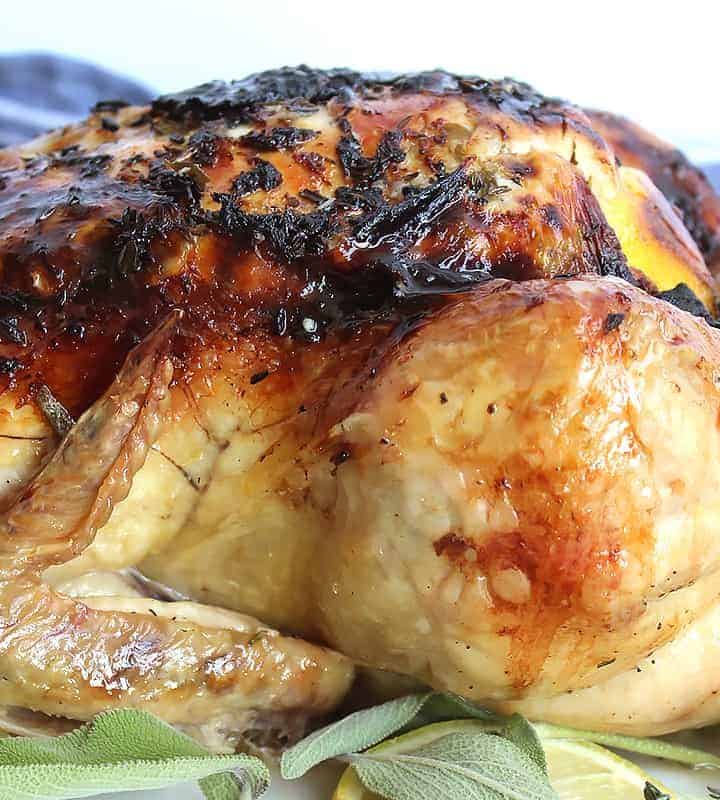 Slow roasted chicken on top of lemon and fresh herbs