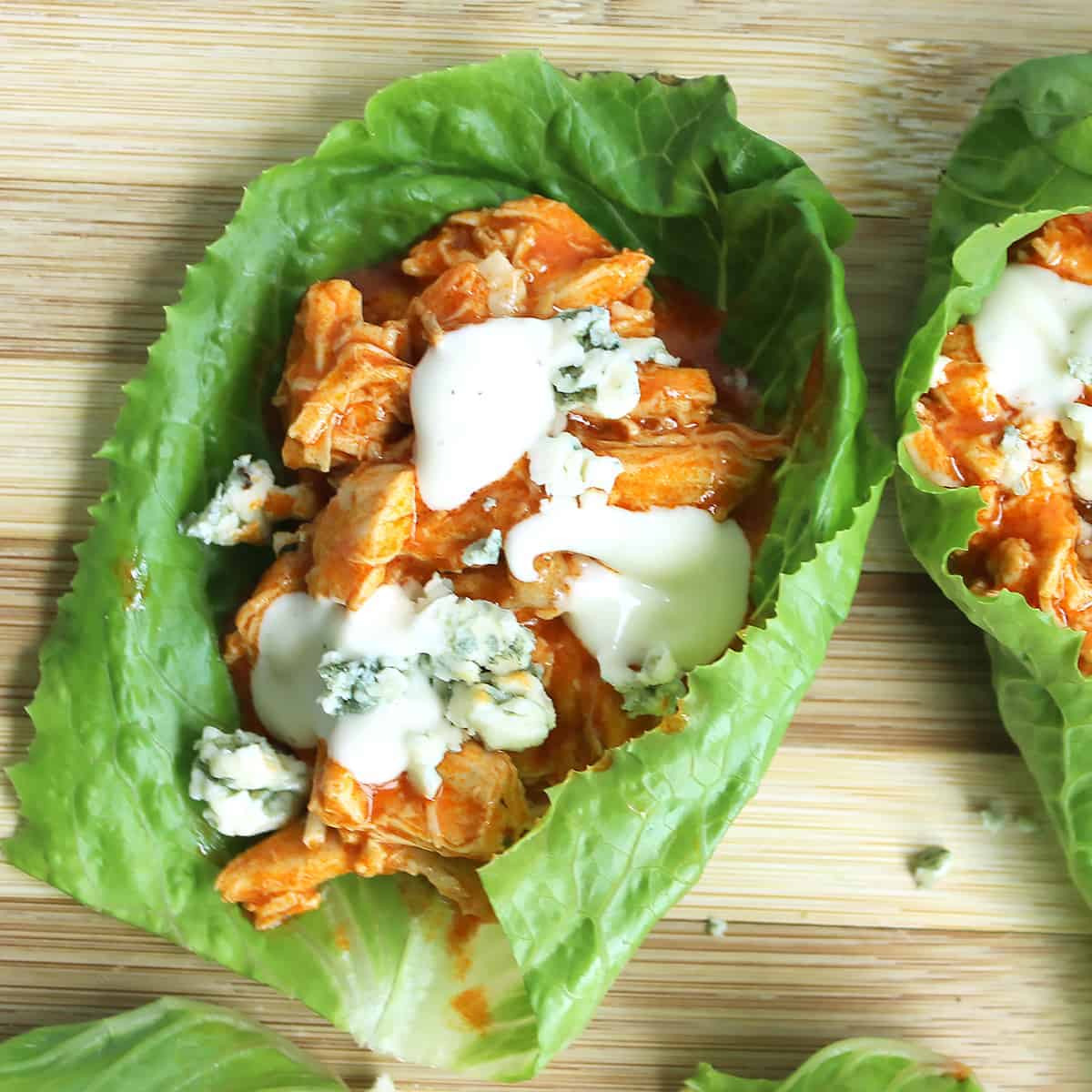 Close up of a buffalo chicken lettuce wrap