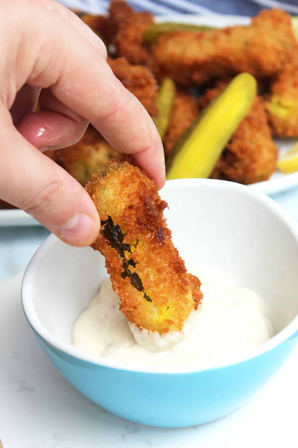 Dipping a frickle into ranch sauce