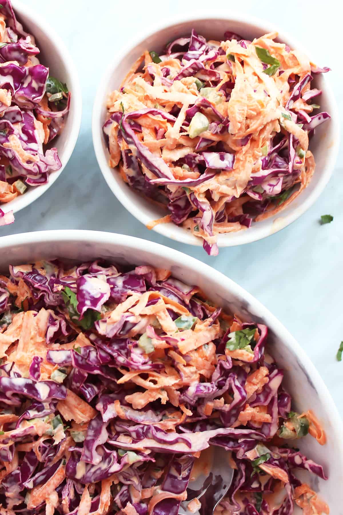 Slaw served into two smaller bowls
