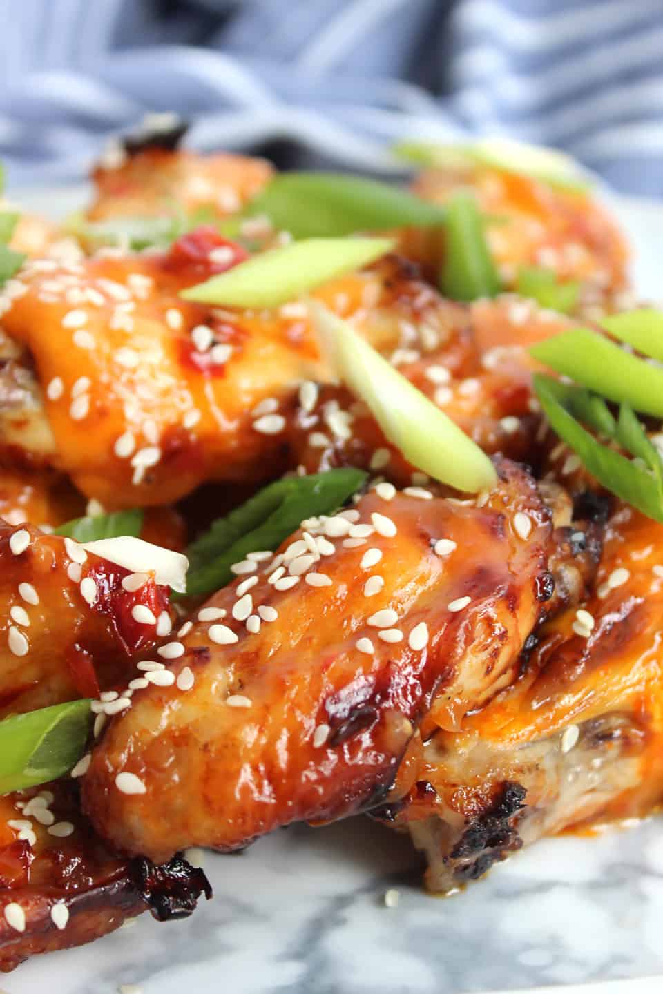 Chili and pineapple wings piled on top of each other