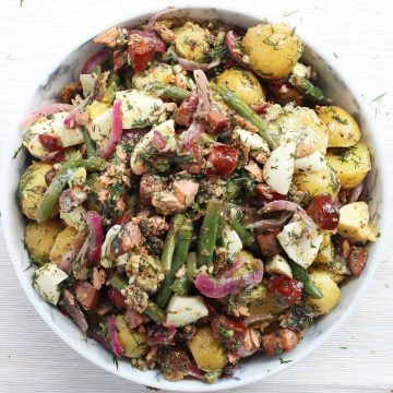 The mixed potato chorizo and trout salad in a serving bowl