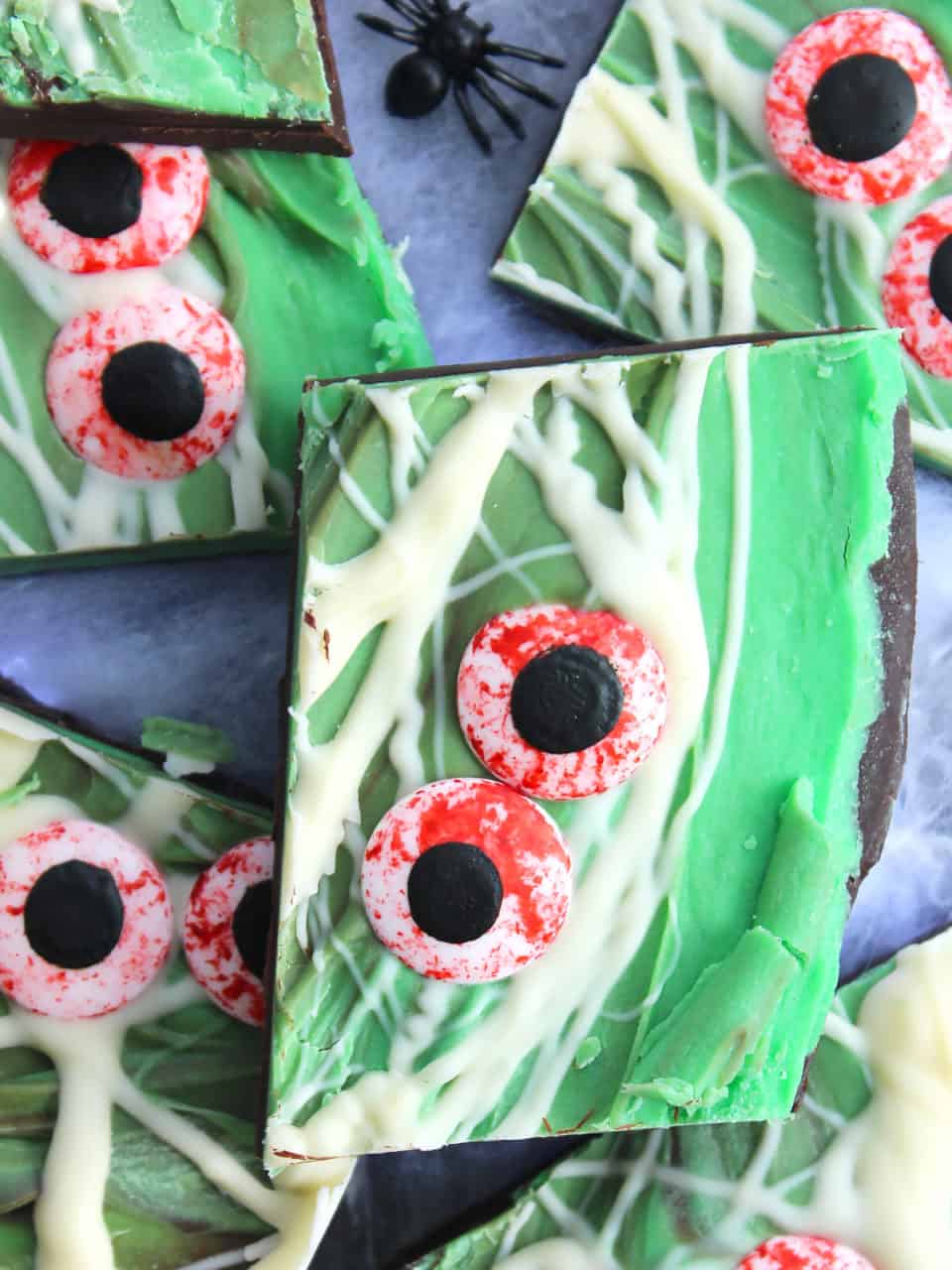 Close up of a piece of halloween bark with candy eyes.