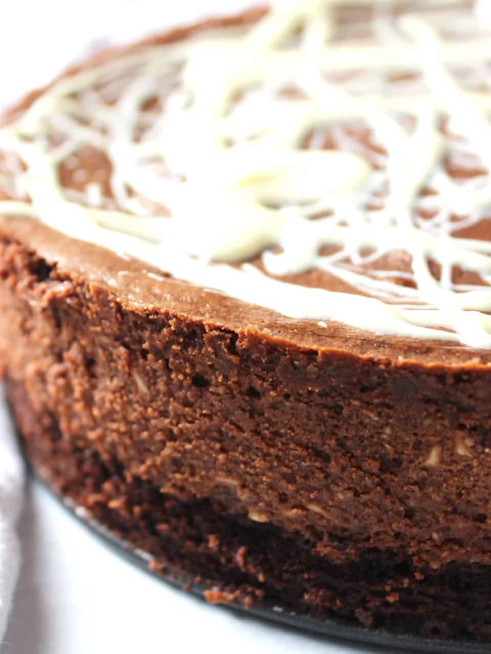 Close up of the side of the brownie bottomed cheesecake.