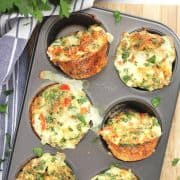 Four egg white bites baked in a muffin tin.