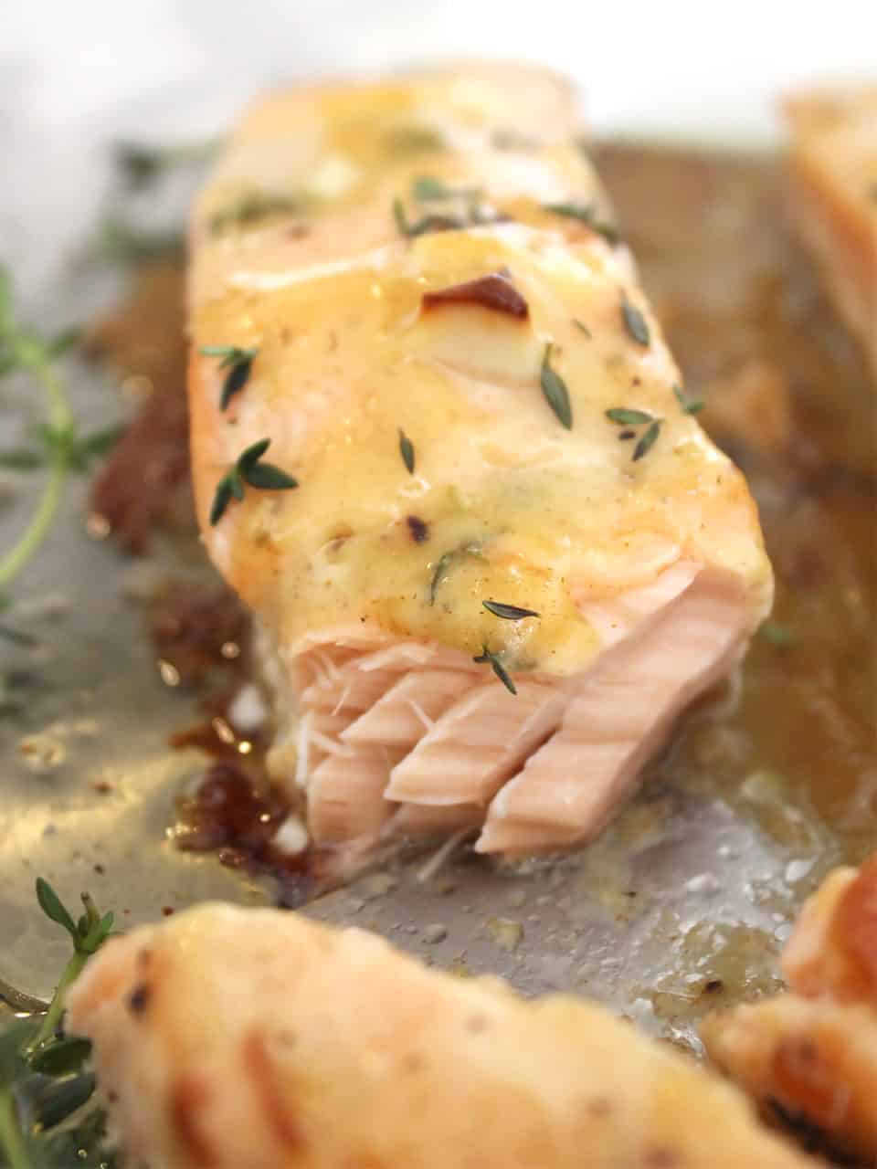 A honey mustard salmon fillet with the end cut off.