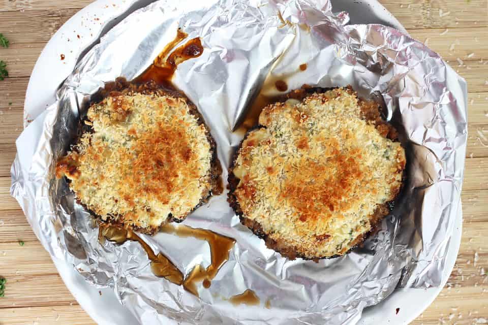 The baked mushrooms in a dish lined with foil.