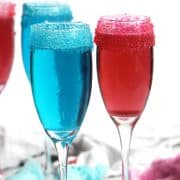 A blue and pink cotton candy champagne next to each other.