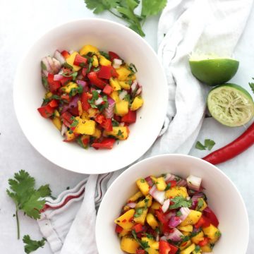 Spicy mango salsa served in two white bowls.