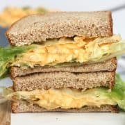 Buffalo egg salad served in a sandwich with fresh lettuce.