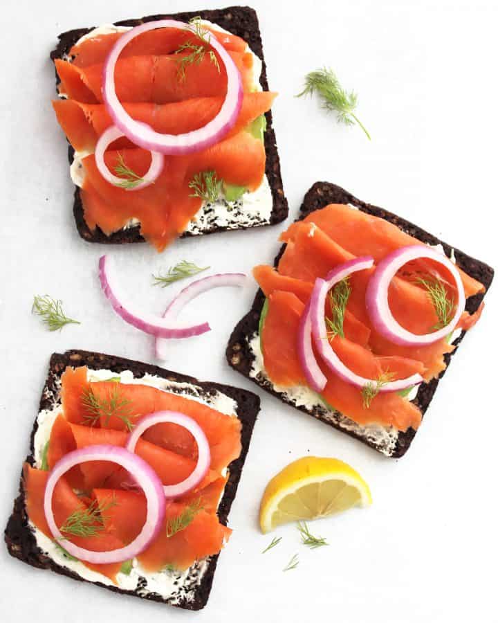 Overhead shot of there open faced smoked salmon sandwiches.