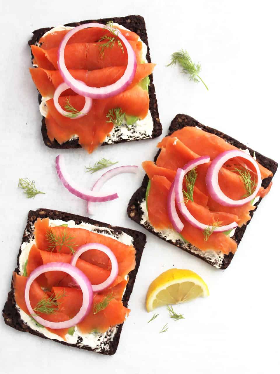 Overhead shot of there open faced smoked salmon sandwiches.