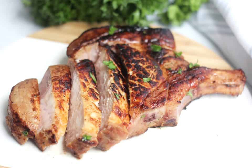 A reverse seared pork chop sliced into strips.
