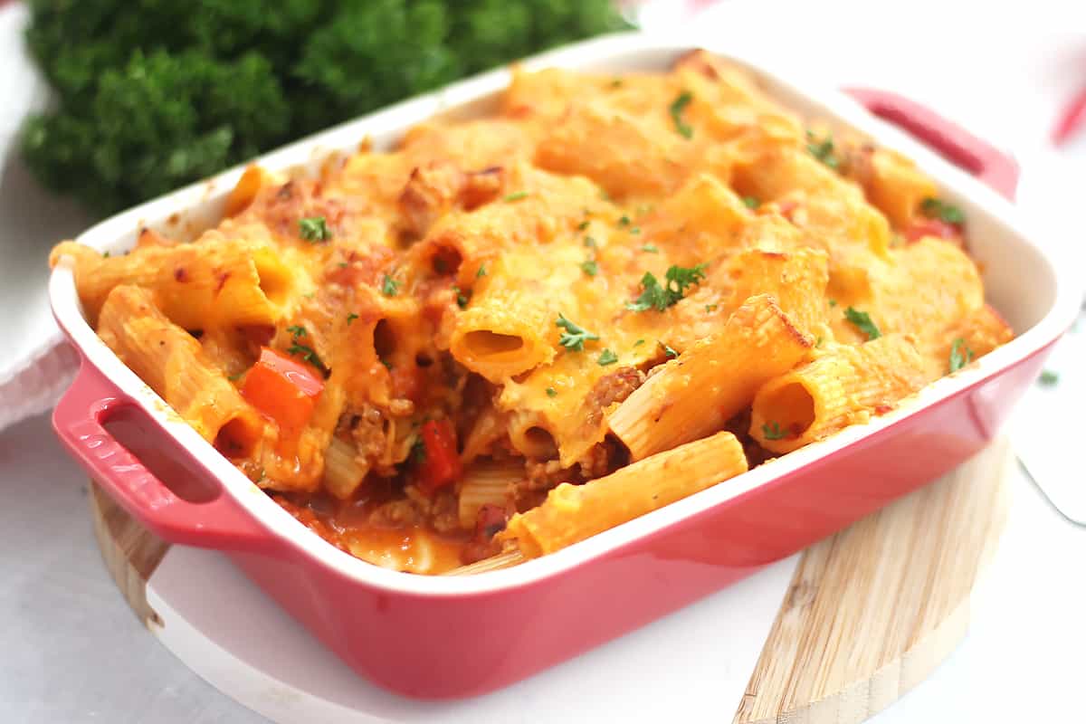 Air fryer pasta bake in a red dish.
