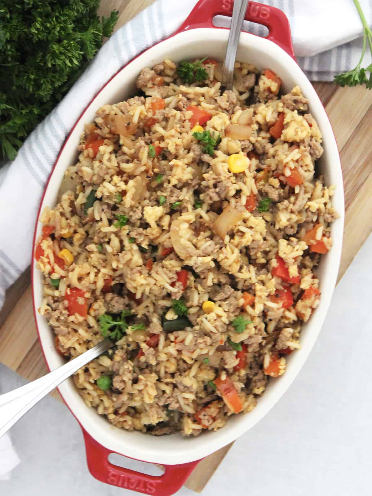 Turkey fried rice served in a red baking dish.