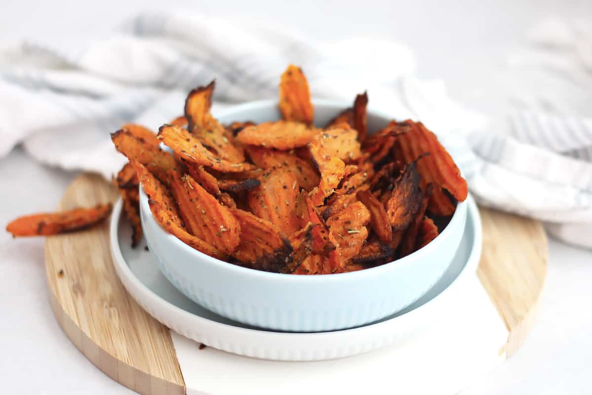 Sweet and savory carrot chips in a serving bowl.