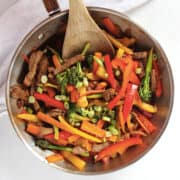 Marinated beef vegetable stir fry in a skillet ready to serve.