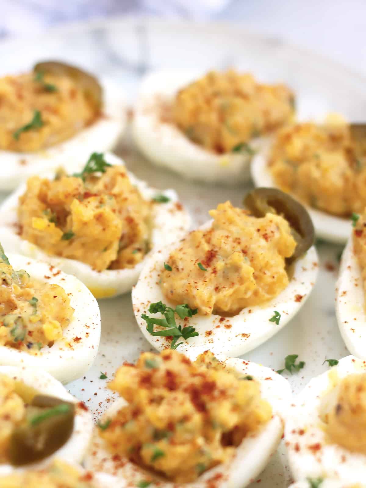 Mexican deviled eggs with a sprinkle of chili powder.