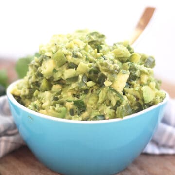 Guacamole piled high in a small bowl.