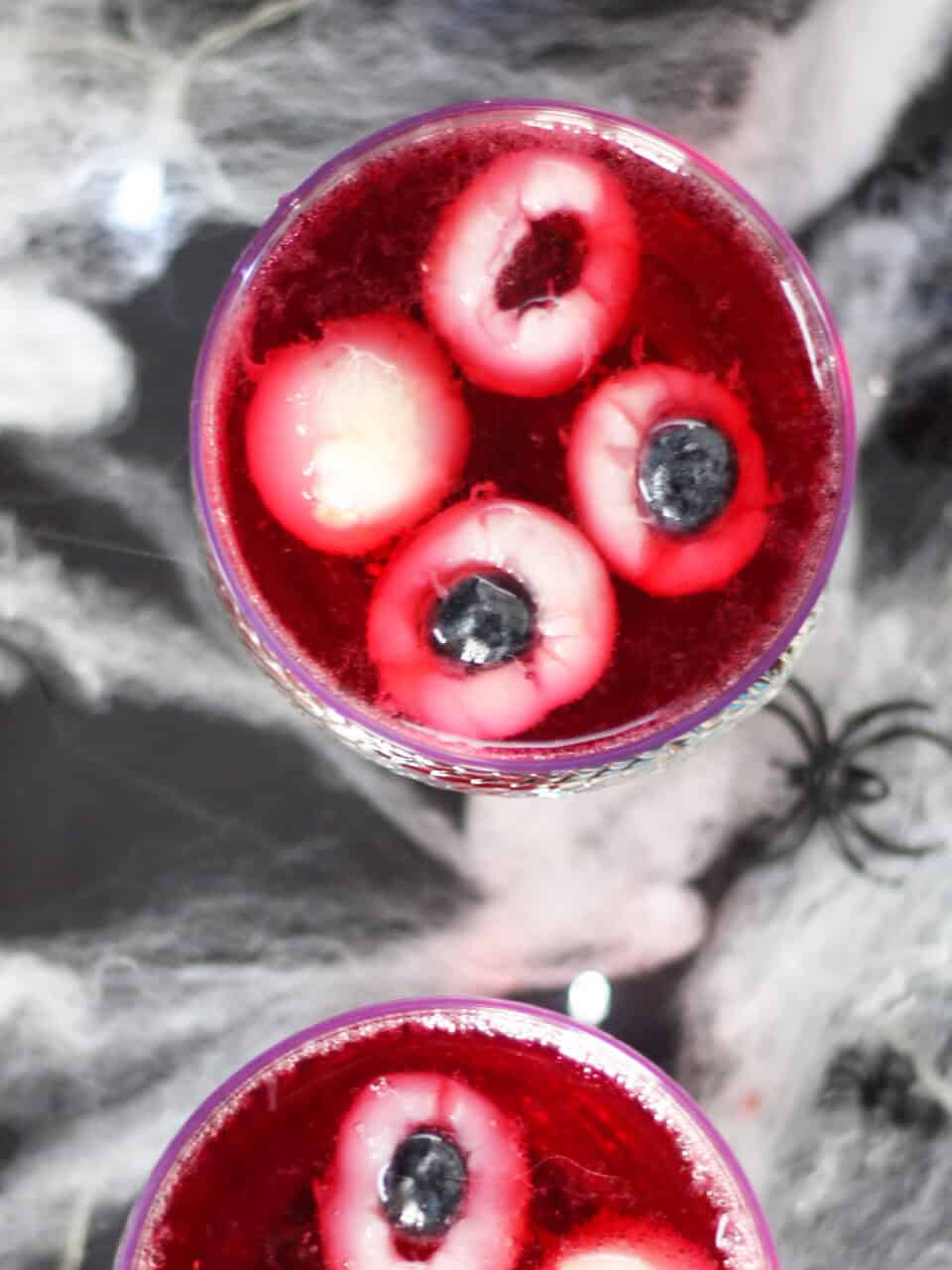 Edible eyeballs in a red drink.