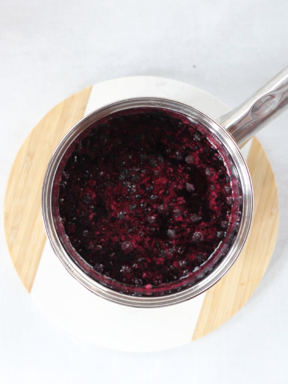 Blueberries simmering in a pot.