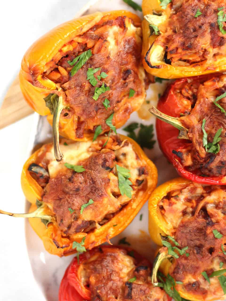 Cheese topped stuffed peppers.