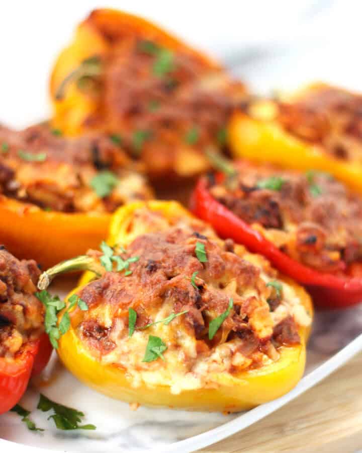 Stuffed bell peppers served on a plate.