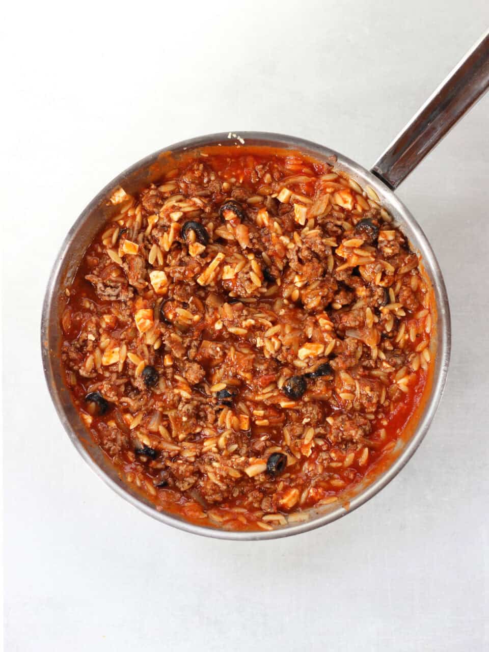 The beef and orzo filling in a skillet,