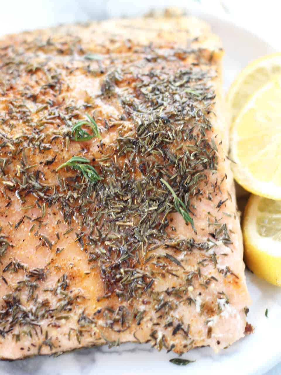 Close up of seasoning on top of baked salmon.