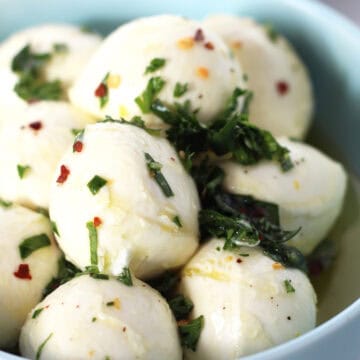 Bocconcini balls marinated with fresh herbs and spices.