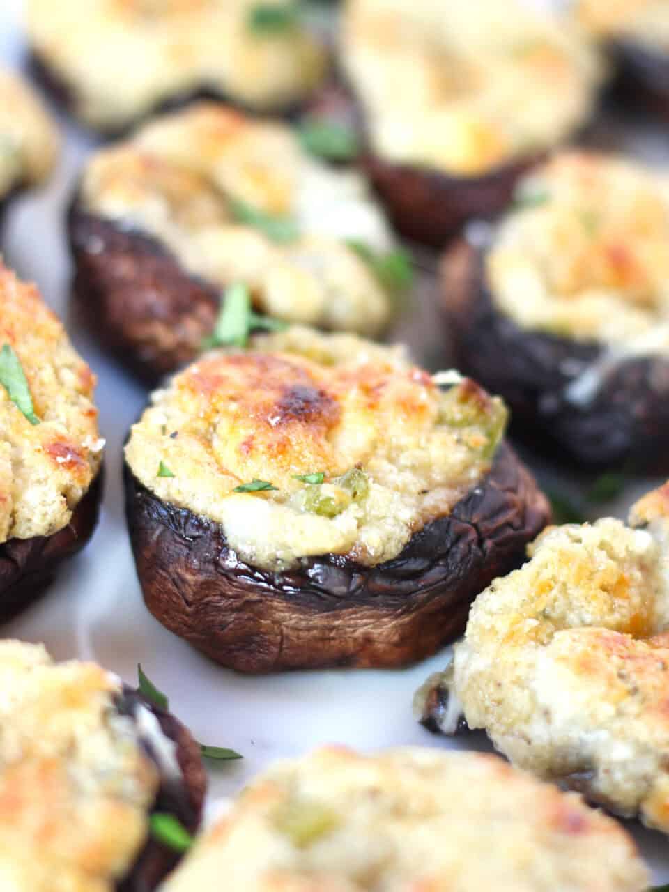 A baked stuffed mushroom with browned top.