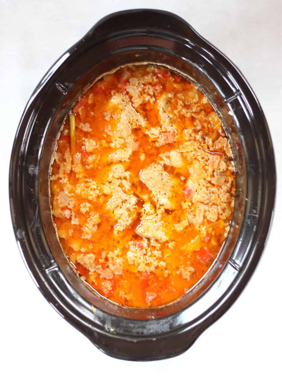 The curry in the Crockpot once it is cooked.