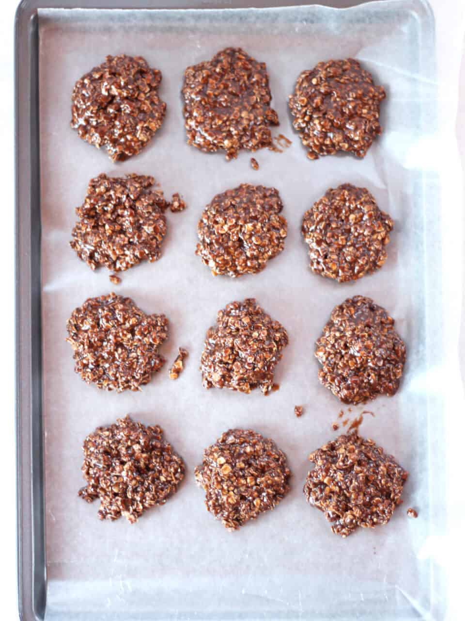 Cookie mixture spooned on to a wax lined baking sheet.